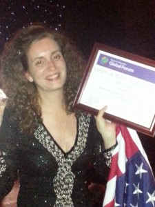 U.S. Team member Kelli Etheredge holds her award with pride
